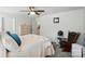 Comfortable main bedroom featuring neutral walls, ceiling fan, and view of the attached bathroom at 2282 Redstone Dr, York, SC 29745