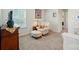 Cozy sitting area with a comfortable armchair, ottoman, and soft carpeting for a relaxing retreat at 2282 Redstone Dr, York, SC 29745