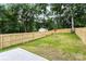 The backyard features a storage shed and a privacy fence for peace of mind at 2818 Old Steele Creek Rd, Charlotte, NC 28208