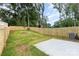 Large fenced backyard with a concrete patio offers plenty of space for enjoyment at 2818 Old Steele Creek Rd, Charlotte, NC 28208