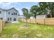 The backyard features a privacy fence and ample space for outdoor activities at 2818 Old Steele Creek Rd, Charlotte, NC 28208