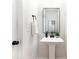 Chic powder room with pedestal sink, modern mirror, and elegant fixtures at 2818 Old Steele Creek Rd, Charlotte, NC 28208