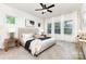 Comfortable bedroom featuring a ceiling fan, neutral tones, and large windows at 2818 Old Steele Creek Rd, Charlotte, NC 28208