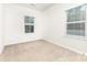 This cozy bedroom is bathed in natural light from two windows at 2818 Old Steele Creek Rd, Charlotte, NC 28208