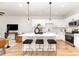 Stylish kitchen with a large central island, barstool seating, and stainless steel appliances at 2818 Old Steele Creek Rd, Charlotte, NC 28208