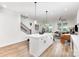 Bright, open kitchen with large island, modern lighting, and stainless steel appliances at 2818 Old Steele Creek Rd, Charlotte, NC 28208