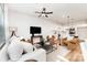 Open-concept living room flowing into the kitchen, featuring modern decor and ample lighting at 2818 Old Steele Creek Rd, Charlotte, NC 28208
