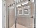 Updated bathroom with a glass shower door and modern lighting, creating a spa-like atmosphere at 282 Harrison Ln, Locust, NC 28097