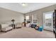 Versatile bonus room with natural light, ideal for an office or creative space with access to outdoor deck at 282 Harrison Ln, Locust, NC 28097