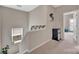 Bright hallway with railing, window with plants and mini fridge at 282 Harrison Ln, Locust, NC 28097