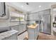 Updated kitchen with an island, stainless steel appliances, and an abundance of cabinet space at 282 Harrison Ln, Locust, NC 28097