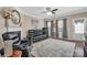 Cozy living room with a fireplace, large area rug, and lots of comfortable seating at 282 Harrison Ln, Locust, NC 28097