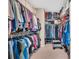Spacious walk-in closet with ample hanging and shelving space for organized storage of clothing and accessories at 282 Harrison Ln, Locust, NC 28097