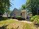 Well-maintained home with a spacious yard and a freshly painted exterior at 3824 Freedom Dr, Charlotte, NC 28208