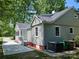 Charming home with a well-maintained yard, newly painted exterior and screened-in side porch at 3824 Freedom Dr, Charlotte, NC 28208