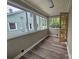 Bright sunroom with hardwood floors and large windows at 3824 Freedom Dr, Charlotte, NC 28208