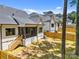 Wide-angle view of a spacious backyard featuring a wooden fence, and covered porch at 3949 Plainview Rd, Charlotte, NC 28208