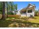 Expansive fenced backyard, perfect for outdoor activities and entertaining, with an inviting screened porch at 3949 Plainview Rd, Charlotte, NC 28208