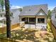 Spacious backyard with a wooden privacy fence and covered porch at 3949 Plainview Rd, Charlotte, NC 28208