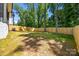 Large, level backyard enclosed by a new wooden fence, offering privacy and plenty of space for recreation at 3949 Plainview Rd, Charlotte, NC 28208