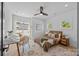 Cozy bedroom features neutral tones, hardwood floors, and a comfortable seating area at 3949 Plainview Rd, Charlotte, NC 28208