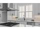 Modern kitchen with stainless steel appliances, sleek countertops, and plenty of natural light at 3949 Plainview Rd, Charlotte, NC 28208