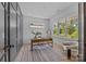 Bright home office with a large window offering natural light, complemented by a modern desk and decor at 3949 Plainview Rd, Charlotte, NC 28208
