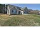 Charming home with muted green siding, dark shutters, and well-manicured lawn at 4017 Avis Way, Monroe, NC 28110