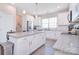 Bright kitchen featuring an island with granite countertops, stainless steel appliances, and ample cabinet space at 4017 Avis Way, Monroe, NC 28110