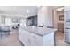 Open-concept kitchen with island featuring granite countertops, connecting to the living room at 4017 Avis Way, Monroe, NC 28110