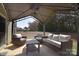 Inviting covered patio with comfortable seating, ideal for outdoor relaxation and entertaining with backyard views at 4017 Avis Way, Monroe, NC 28110