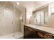 Modern bathroom with tile shower featuring a glass door and a vintage vanity with a marble countertop at 4023 Alexandra Alley Dr, Charlotte, NC 28210