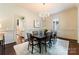 Formal dining room features a modern chandelier, and ample space for entertaining at 4023 Alexandra Alley Dr, Charlotte, NC 28210