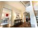 Inviting foyer with an open floor plan, hardwood floors, and grand staircase at 4023 Alexandra Alley Dr, Charlotte, NC 28210
