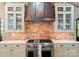 Chef's kitchen features a professional range, custom cabinets, and designer finishes at 4023 Alexandra Alley Dr, Charlotte, NC 28210