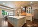 Spacious kitchen features a brick wall, an oversized island and stainless steel appliances at 4023 Alexandra Alley Dr, Charlotte, NC 28210