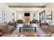 Living room with exposed beams, brick fireplace, and ample seating at 4023 Alexandra Alley Dr, Charlotte, NC 28210