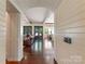 Open-concept living room with hardwood floors, arched entryway, and a bright atmosphere at 4023 Alexandra Alley Dr, Charlotte, NC 28210