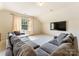 Spacious living room featuring a large sectional sofa and a wall-mounted television at 4023 Alexandra Alley Dr, Charlotte, NC 28210