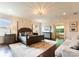 Spacious main bedroom with wood floors, a seating area and a luxurious ensuite bathroom at 4023 Alexandra Alley Dr, Charlotte, NC 28210