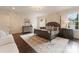 Comfortable bedroom features a decorative rug, light colored walls and two windows at 4023 Alexandra Alley Dr, Charlotte, NC 28210