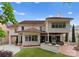 Expansive rear of home featuring a lush lawn, outdoor kitchen, and inviting covered patio for entertainment at 4023 Alexandra Alley Dr, Charlotte, NC 28210
