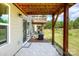 View of the home's backyard featuring a patio and backyard with trees at 411 Lahinch Dr, Tega Cay, SC 29708