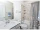 Neutral-toned bathroom featuring shower-tub combination and a modern vanity sink at 411 Lahinch Dr, Tega Cay, SC 29708