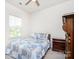 Cozy bedroom features natural light from the large window and a dark-wood dresser at 411 Lahinch Dr, Tega Cay, SC 29708