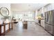 Bright, open kitchen features stainless steel appliances, a large island with seating and easy access to the dining area at 411 Lahinch Dr, Tega Cay, SC 29708