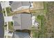 Aerial view of a property with a well-maintained backyard featuring a fire pit and bordered by a black fence at 4268 Coachwhip Ave, Lancaster, SC 29720