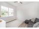 Bright bedroom features a large window, a neutral color scheme, and a comfortable seating area at 4268 Coachwhip Ave, Lancaster, SC 29720