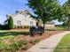 Community clubhouse with manicured lawn, sign and walking path for recreation and relaxation at 4268 Coachwhip Ave, Lancaster, SC 29720