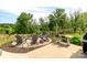 Outdoor space with fire pit area featuring seating, a bar table, and a grill, perfect for entertaining at 4268 Coachwhip Ave, Lancaster, SC 29720